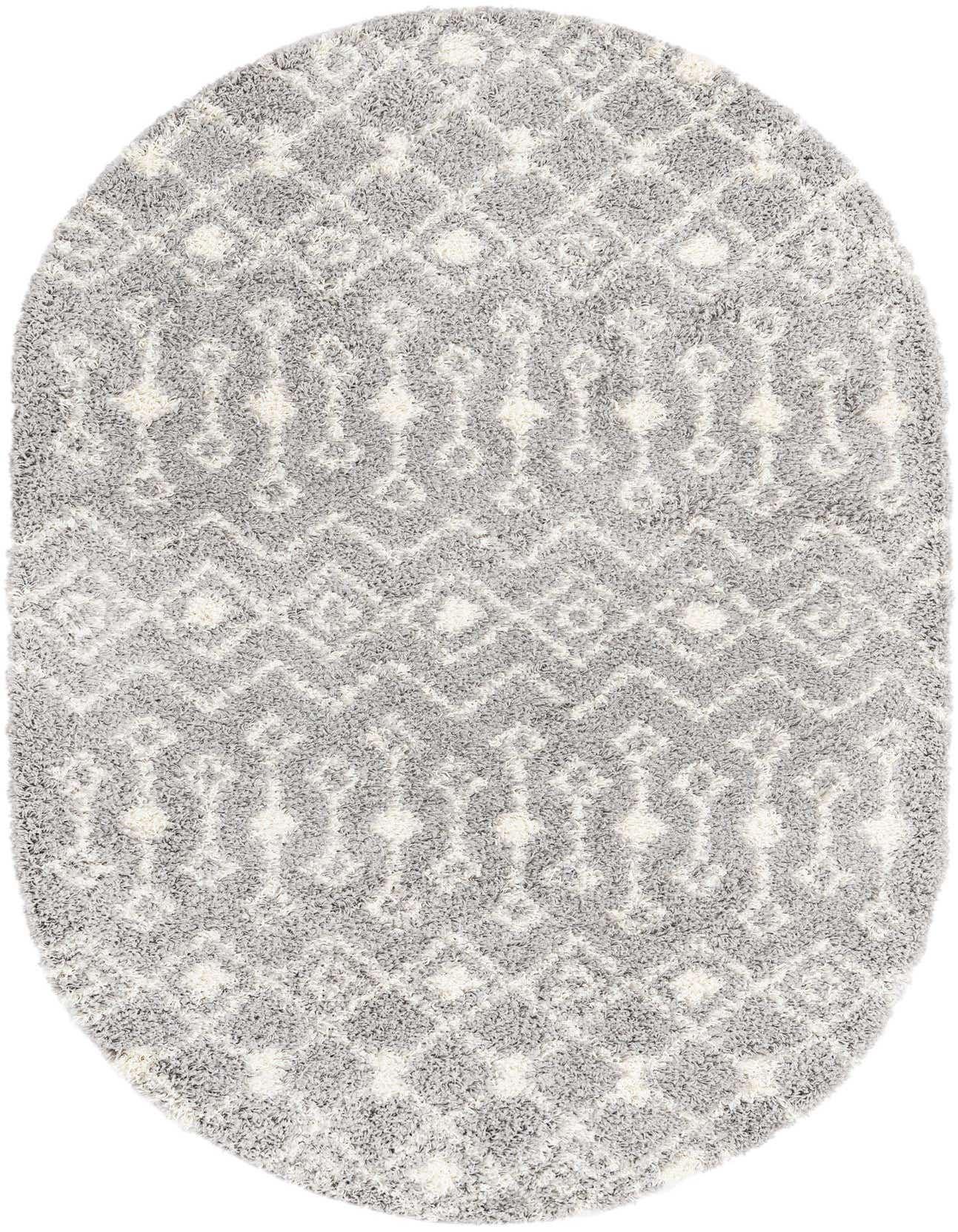 An oval 5'3" x 8'0" gray shag rug with a white tribal trellis pattern, offering a soft texture.