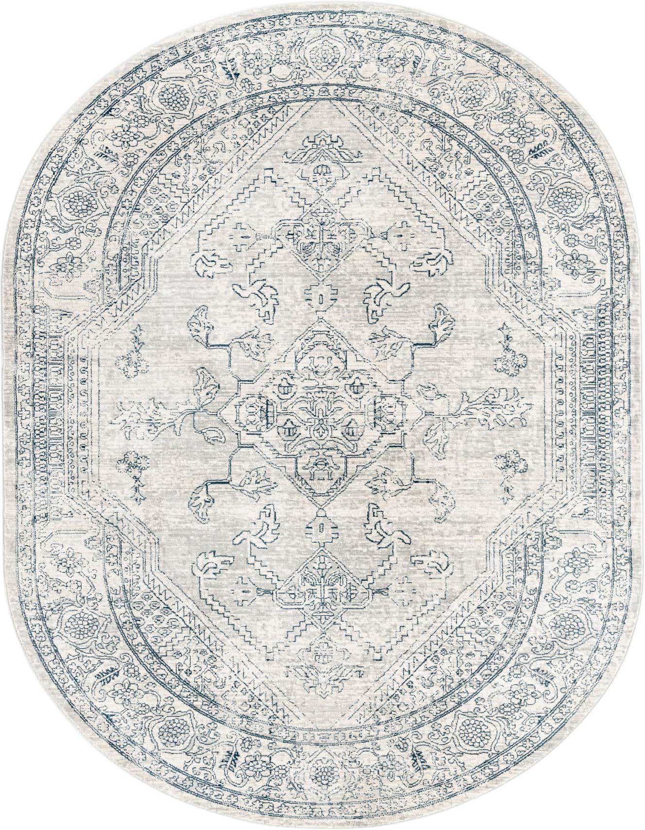 An oval 5'3" x 8'0" gray and silver rug with a faded traditional medallion and tribal pattern.