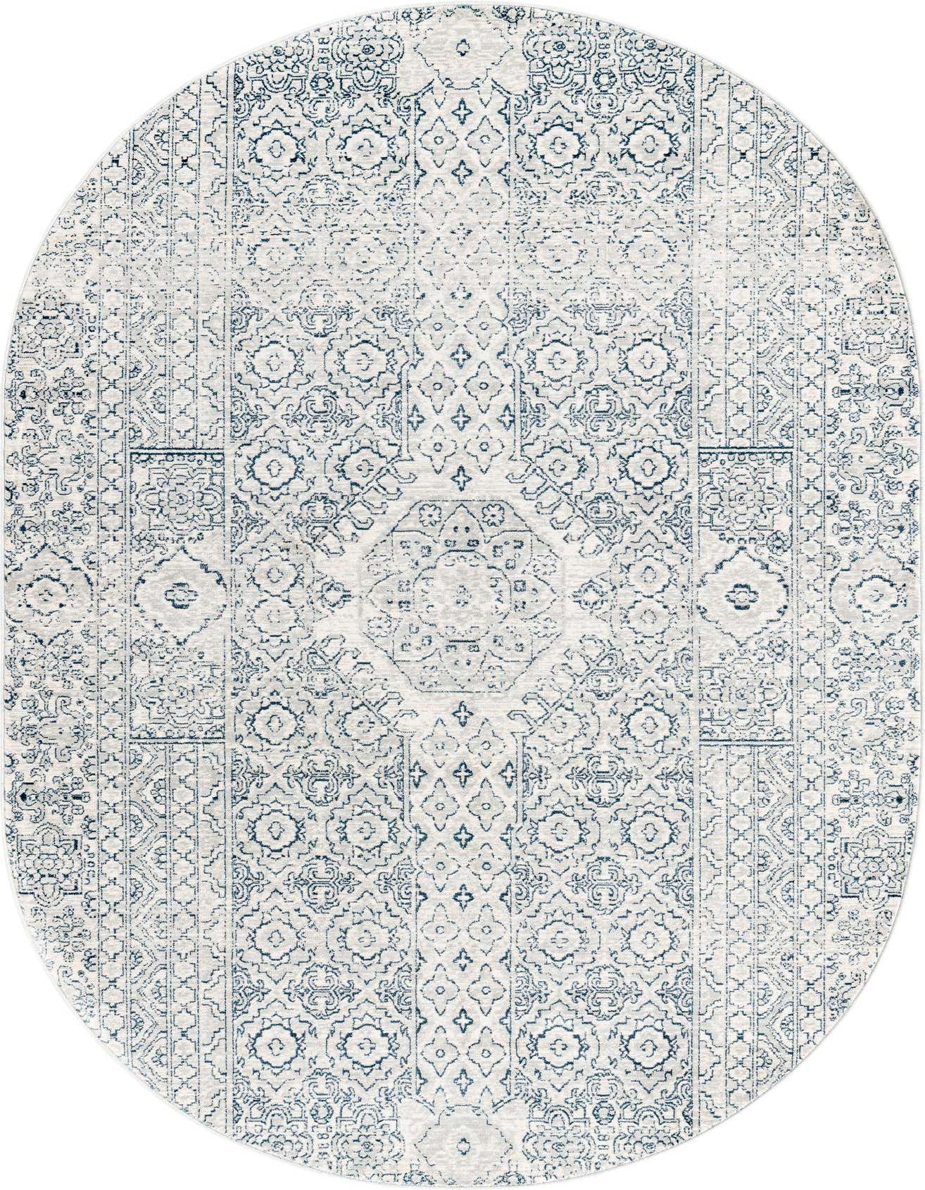 An oval 5'3" x 8'0" gray and silver rug with a distressed traditional medallion and tribal pattern.
