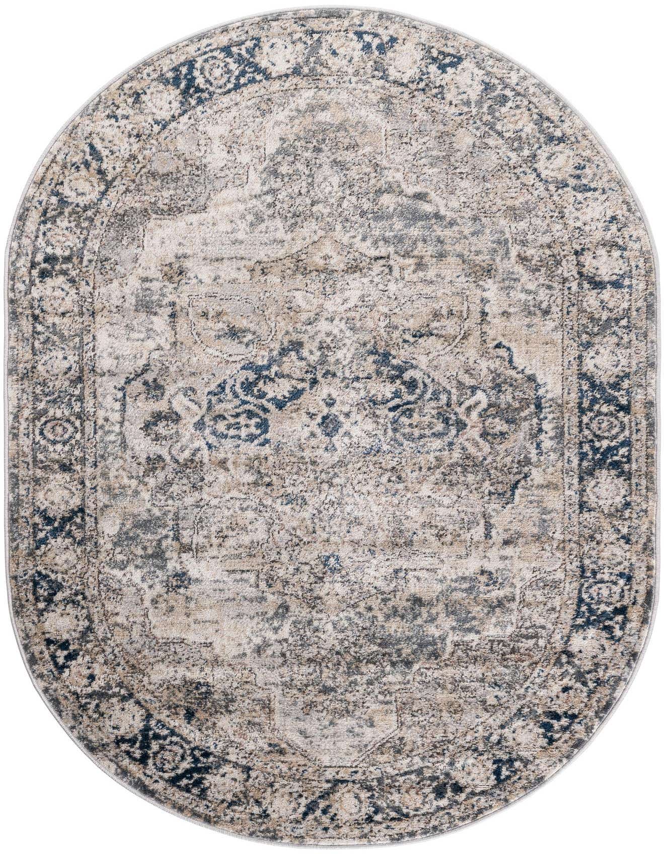 An oval 4' 1 x 6' 1 Oregon Collection rug featuring a distressed gray and silver medallion pattern with dark blue accents.