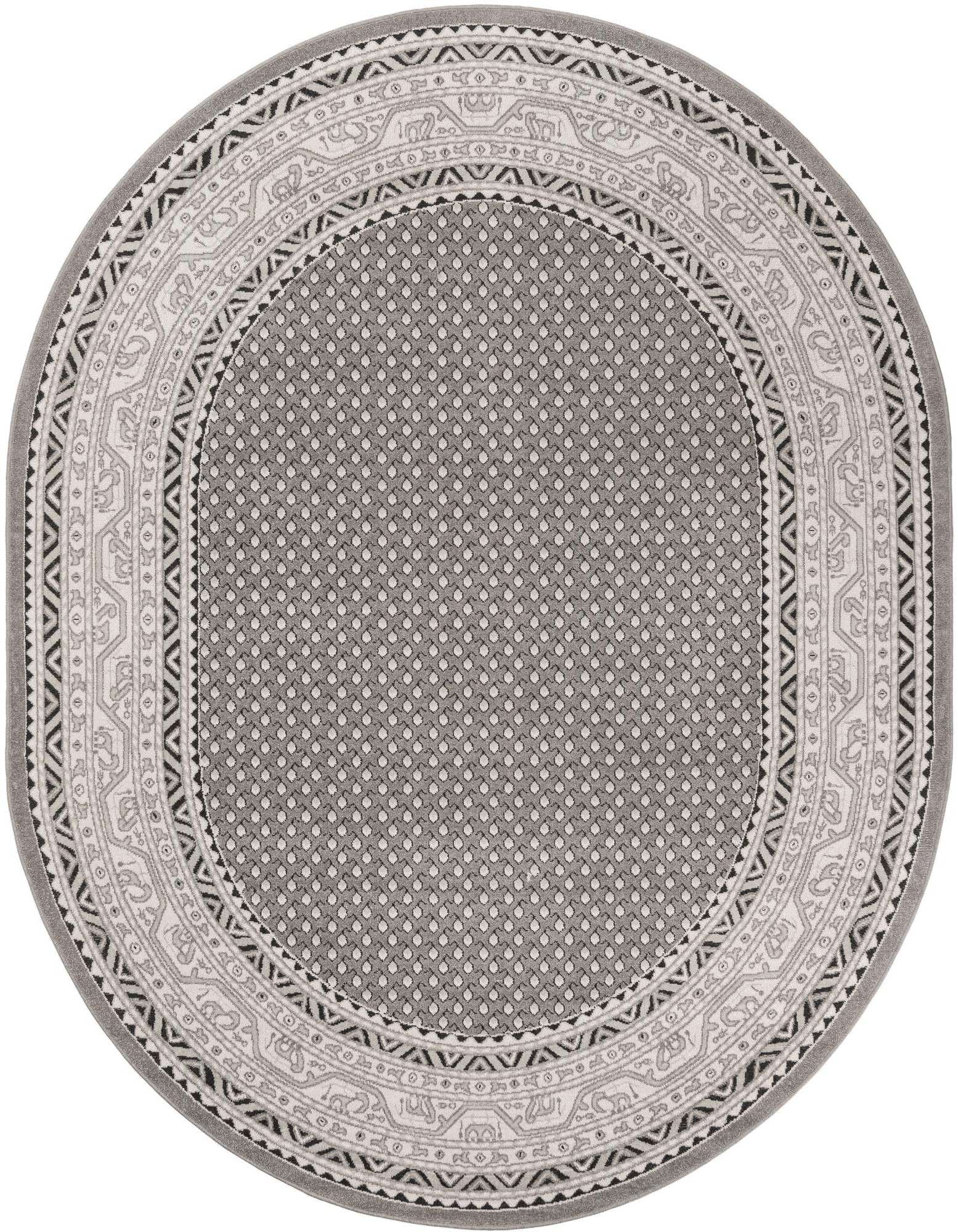 An oval gray and silver transitional rug with a tribal border pattern and dotted center, suitable for various indoor spaces.