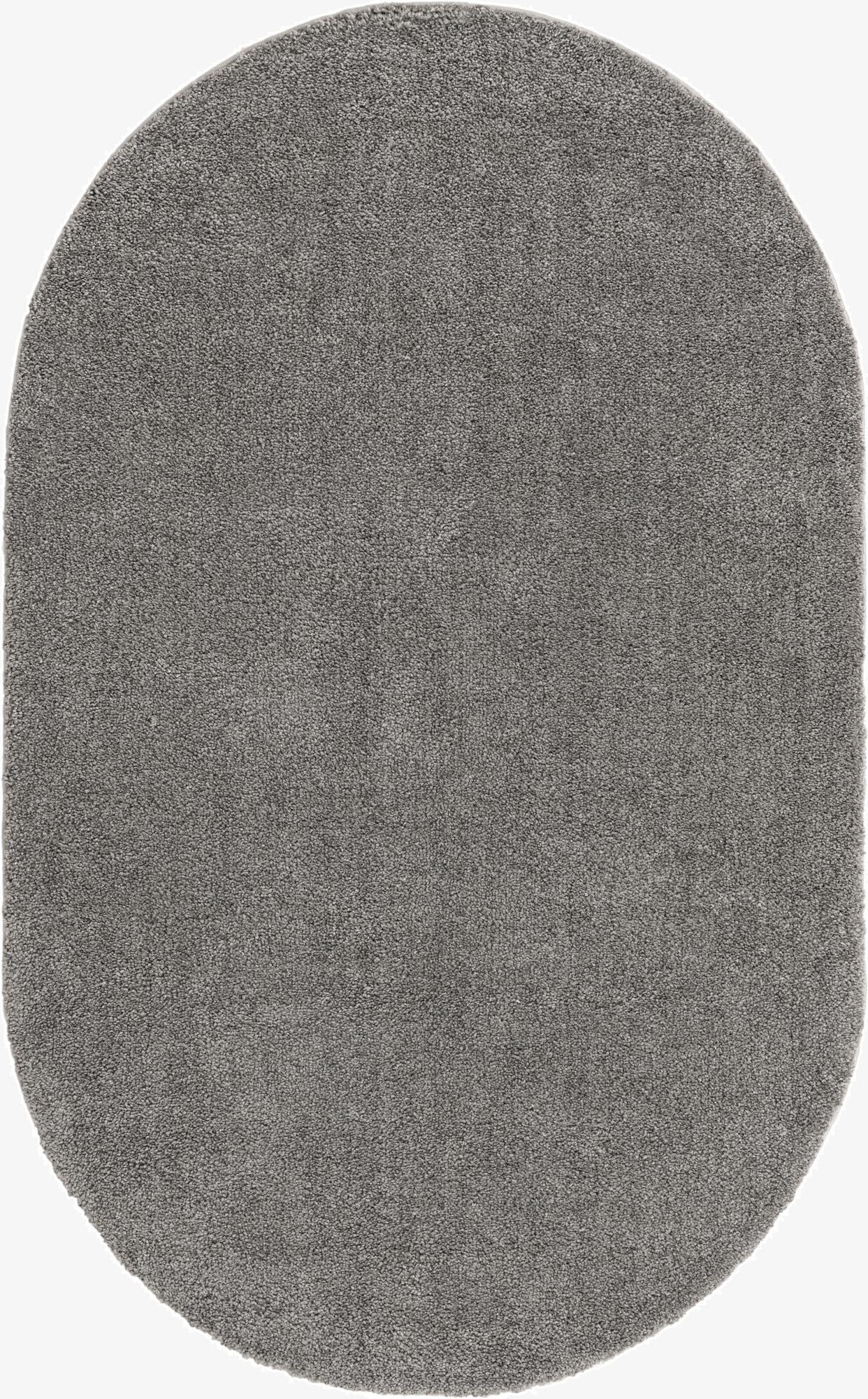 A 5' x 8' oval gray area rug with a textured, solid frieze pile, perfect for a modern living room.