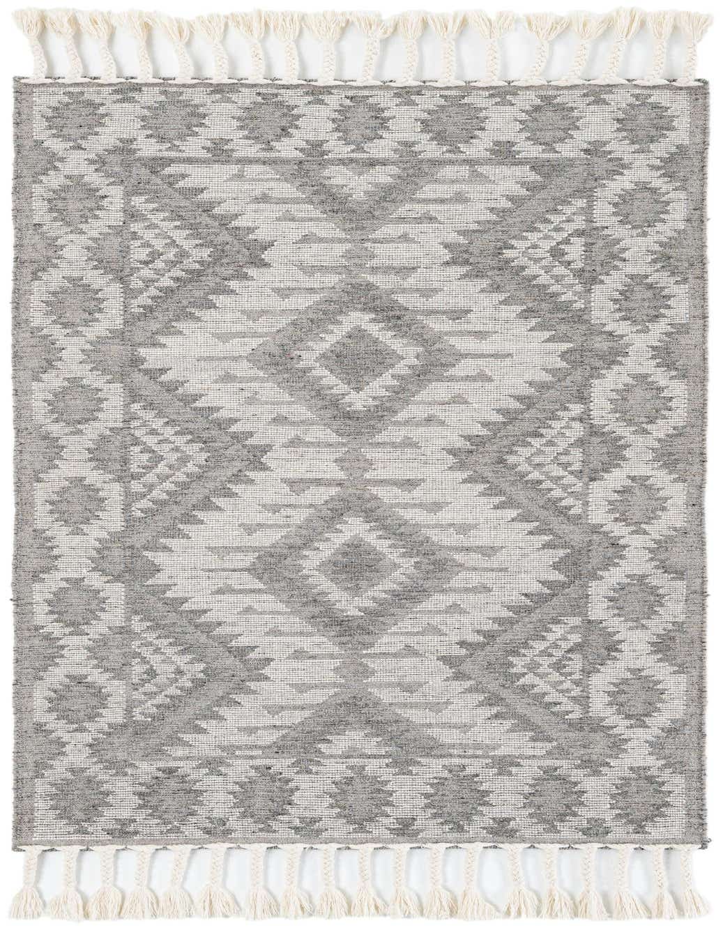 A 5x7 rectangular gray and silver modern abstract wool rug with a shag pile and decorative tassels.