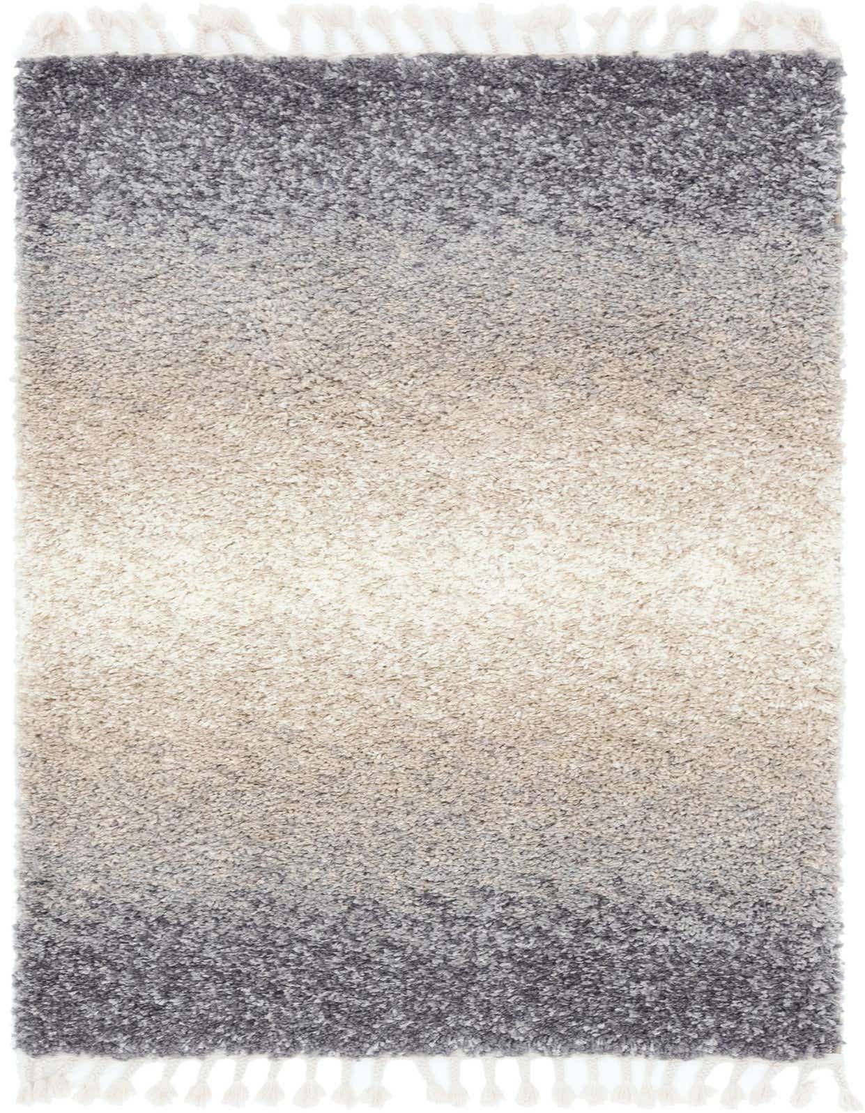 A 4x6 rectangular Athena Shag rug with a gray and silver ombre pattern, transitioning from dark gray to light silver, with white tassels.