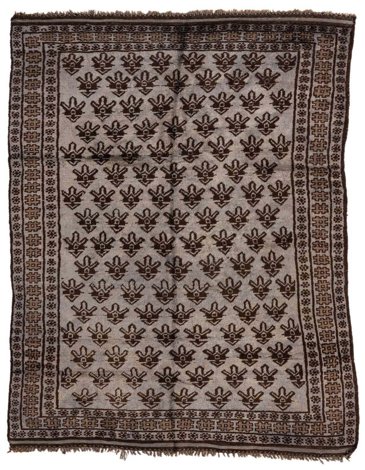 A 5x8 rectangular Balouch rug in gray and brown with a traditional tribal pattern and fringed edges.