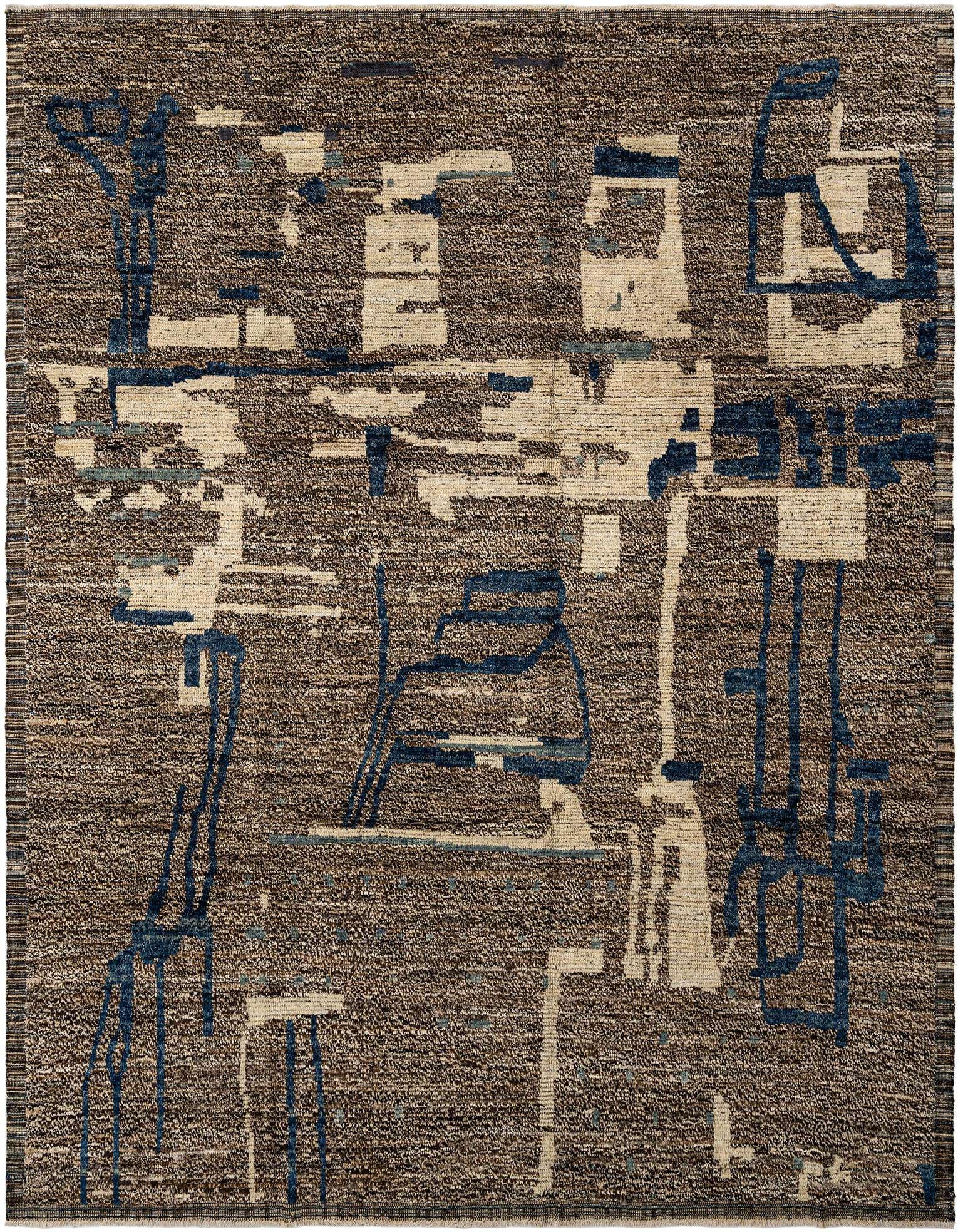 A rectangular handmade wool rug featuring a textured gray base with abstract patterns in cream and dark blue.