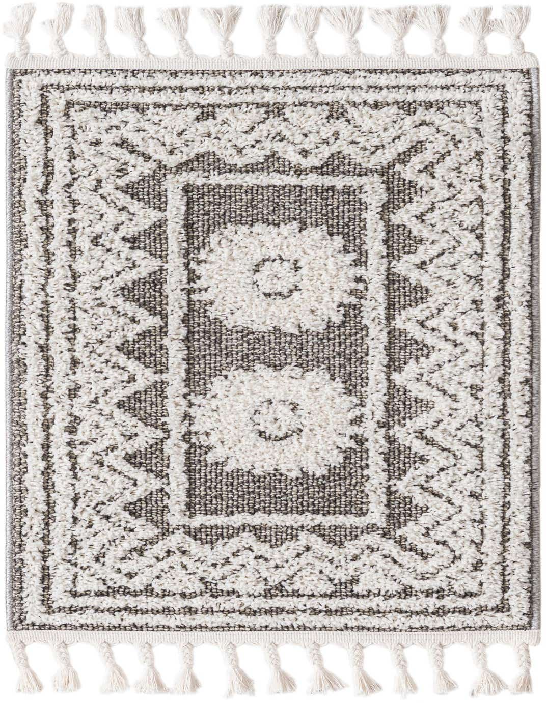 A 2x3 rectangular gray and white Boho rug with a Southwestern medallion pattern and decorative tassels.