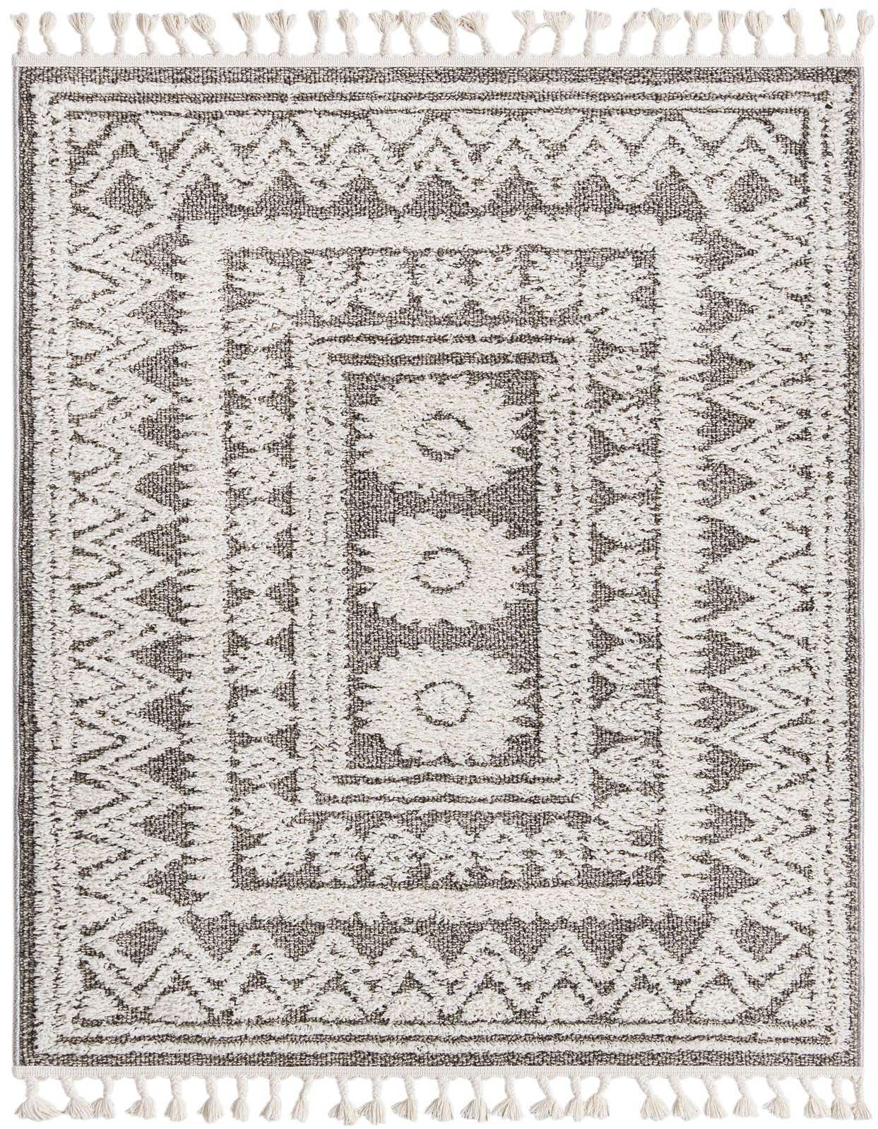 A 4x6 rectangular gray and white Boho rug with Southwestern tribal patterns and decorative tassels.