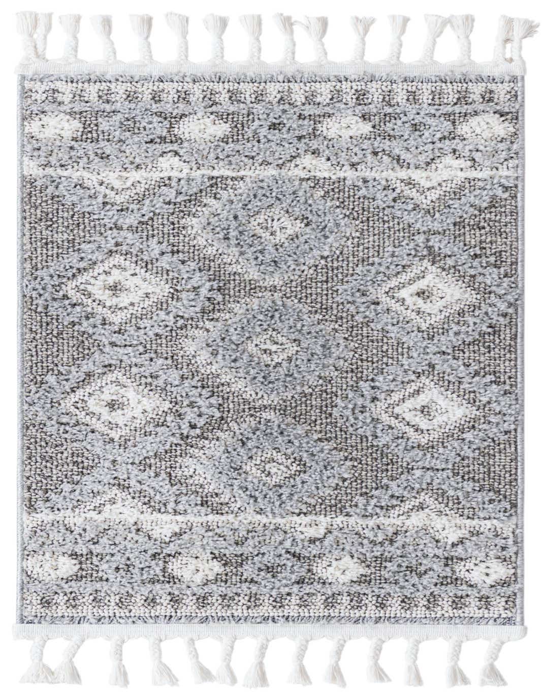 A 2x3 rectangular gray and white southwestern rug with a tribal trellis pattern and decorative tassels.