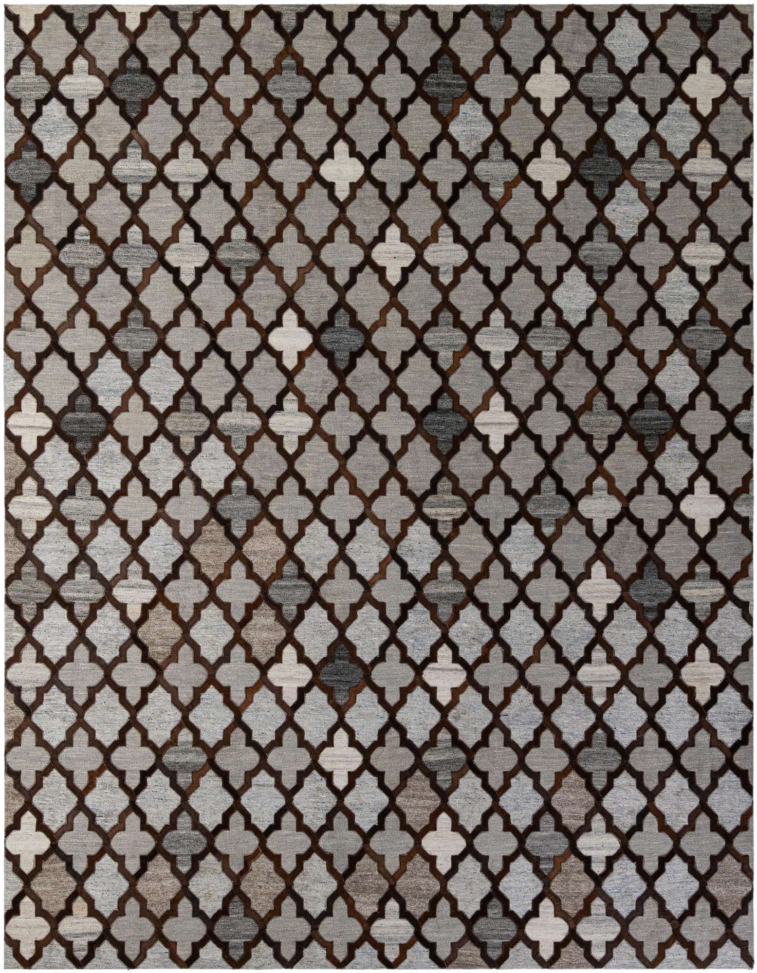 A rectangular 8x10 gray cowhide rug with a modern quatrefoil pattern outlined in dark brown leather, perfect for a living room.