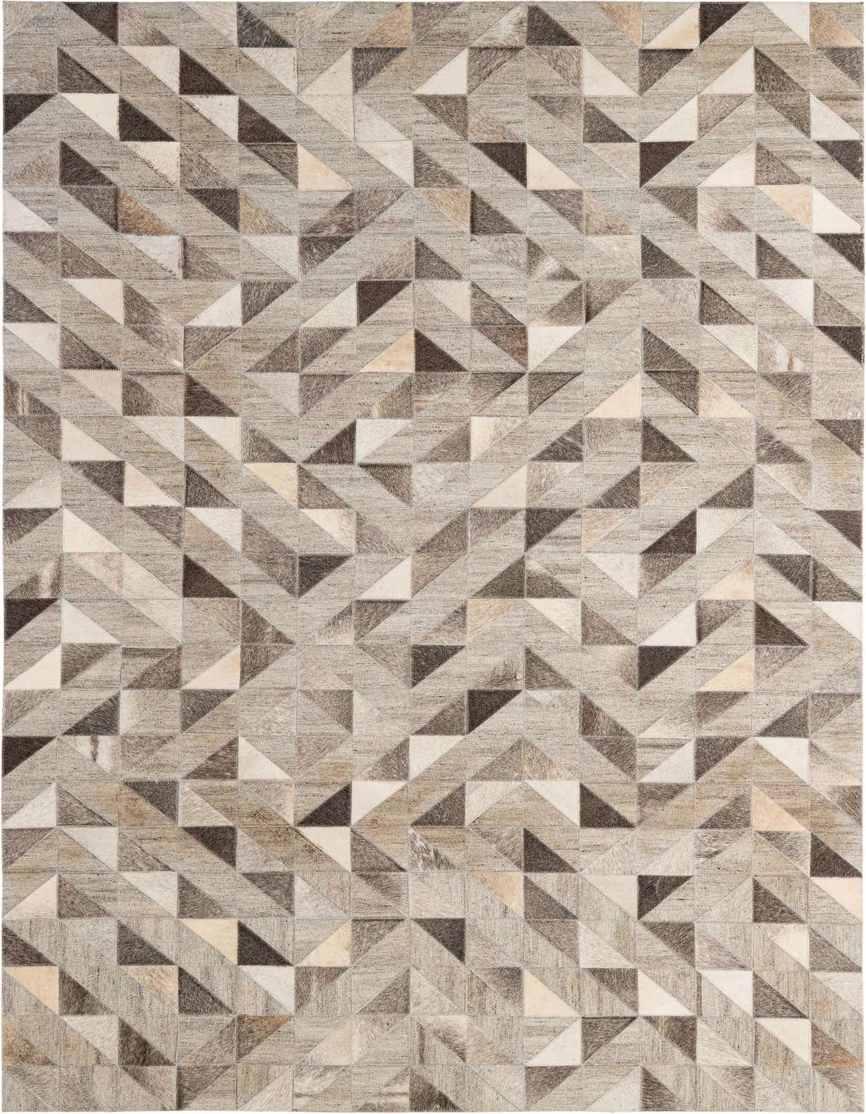 A 5x8 rectangular cowhide rug featuring a modern geometric patchwork pattern in varying shades of gray, silver, and cream.
