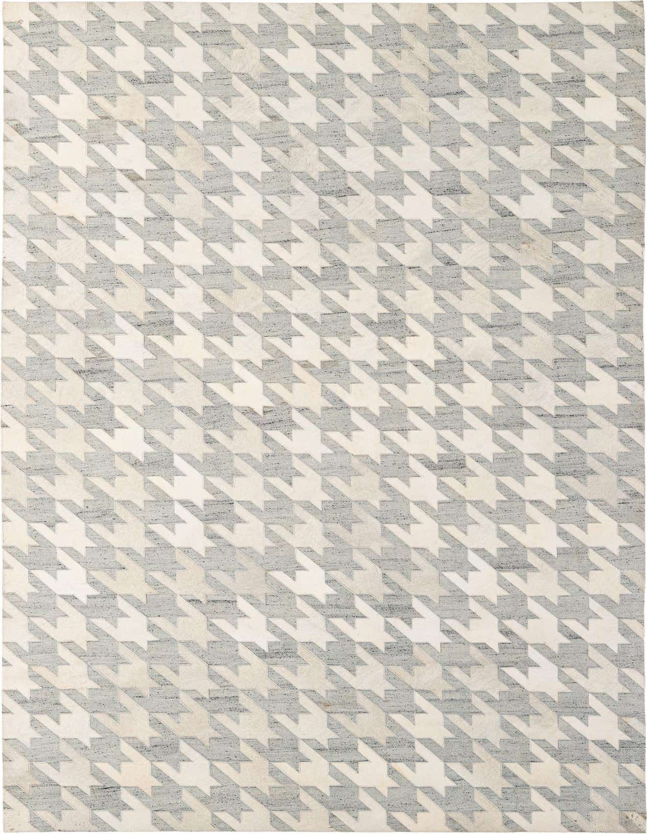 A 5x8 rectangular gray and silver cowhide rug with a modern houndstooth patchwork pattern.