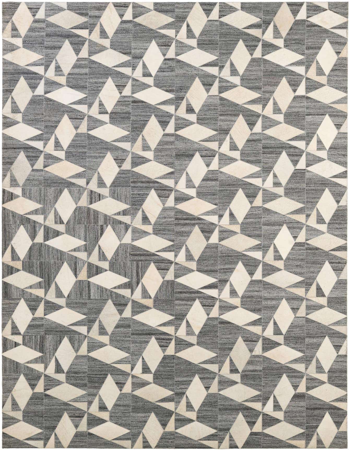 A 5x8 rectangular Cowhide - Patchwork rug featuring a modern geometric pattern of light gray and off-white diamond and triangular shapes on a darker gray background.