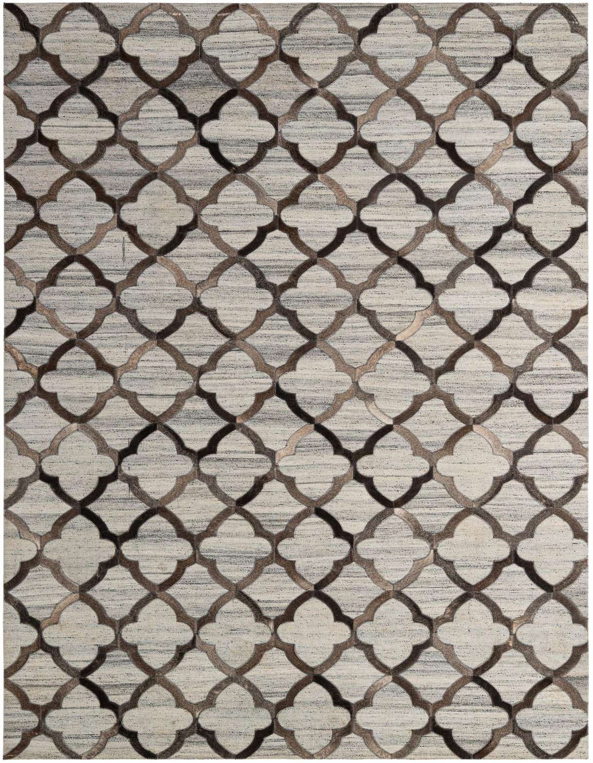 A 5x8 rectangular gray cowhide rug with a modern quatrefoil pattern in varying shades of gray and silver.