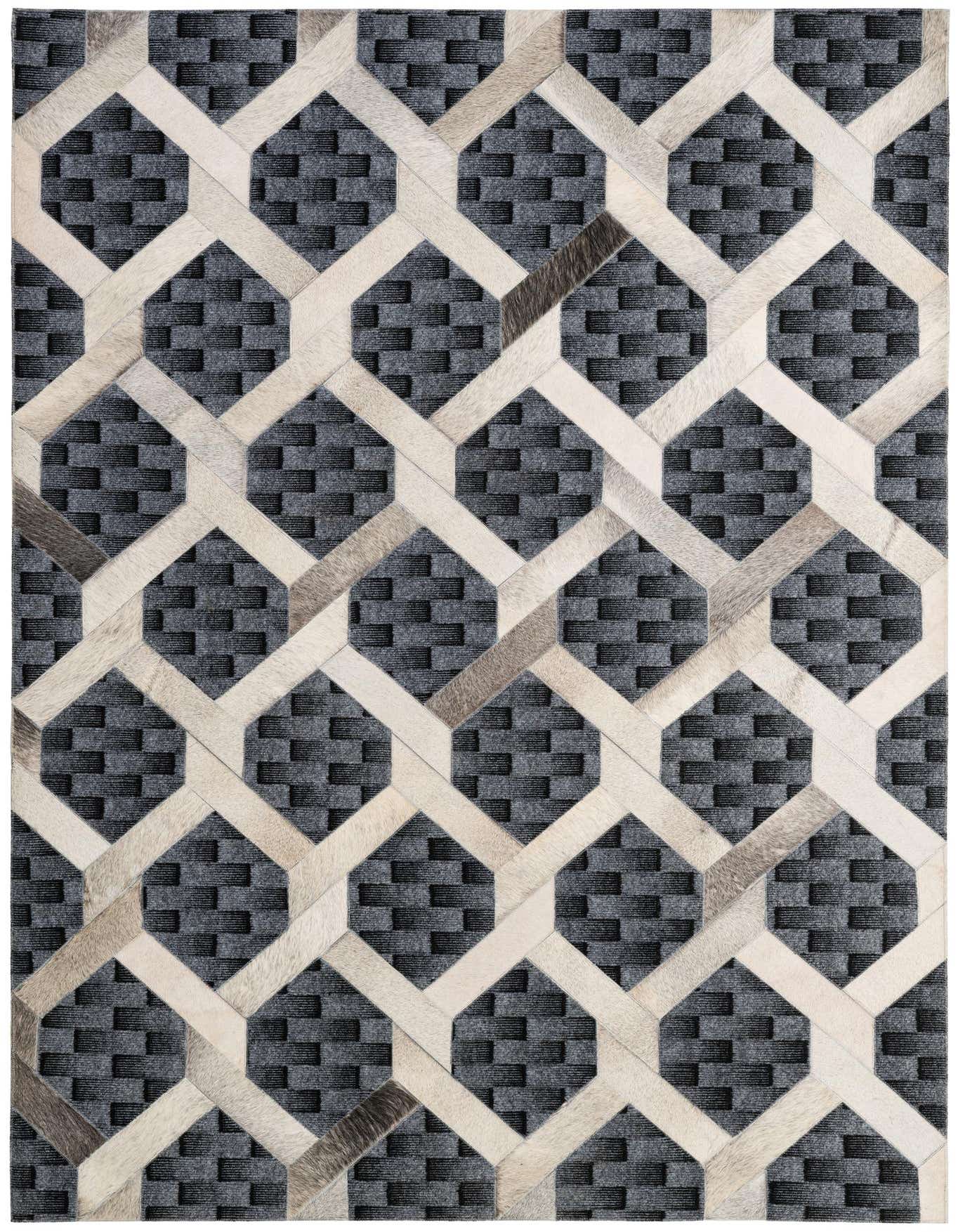 A 5x8 rectangular gray and silver cowhide rug with a modern geometric patchwork pattern, perfect for a living room.