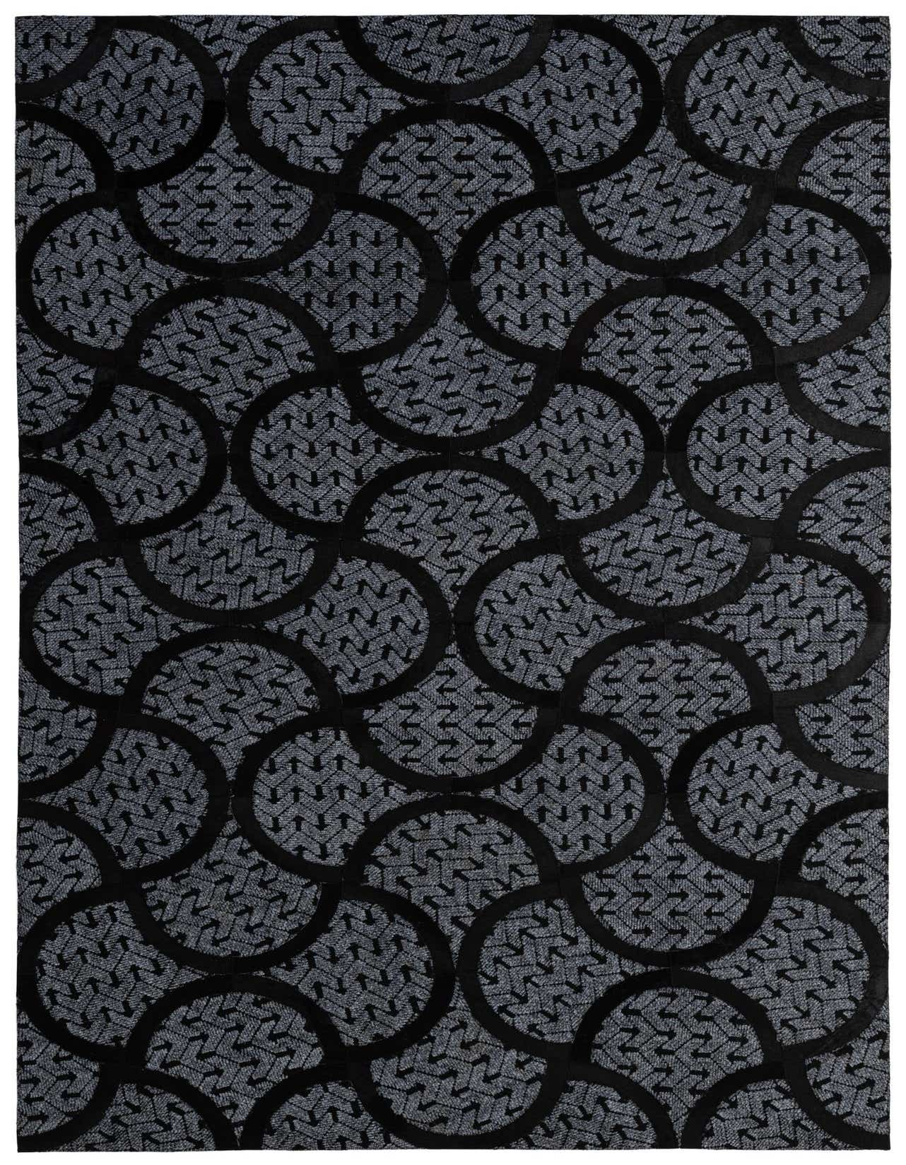 A 5x8 rectangular Cowhide - Patchwork rug featuring a modern abstract pattern of interlocking black circles over a gray textured background.