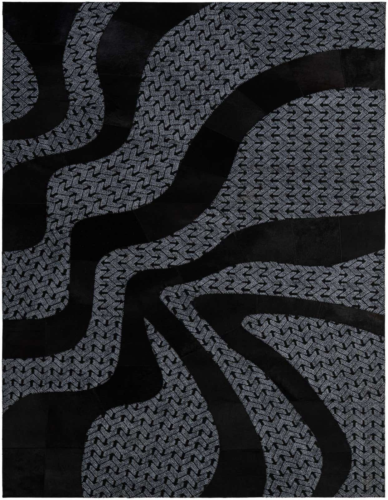 A 5x8 rectangular Cowhide - Patchwork rug featuring a modern abstract design in grays and silvers with black leather accents.