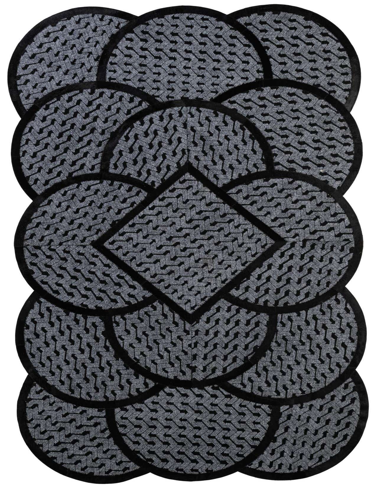 A 5x8 rectangular Cowhide - Patchwork rug in shades of gray and silver, featuring a modern geometric pattern of interlocking circles and a central diamond.