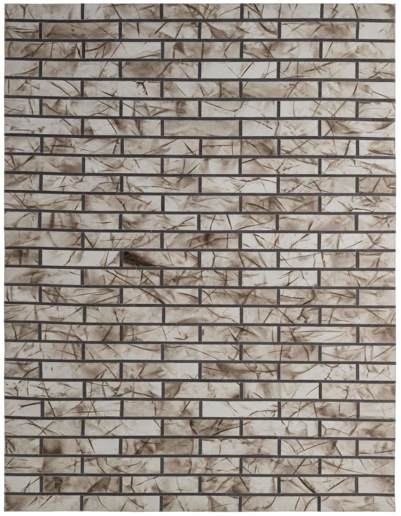 A 5x8 rectangular Cowhide - Patchwork rug featuring a modern, abstract pattern in shades of gray and silver.