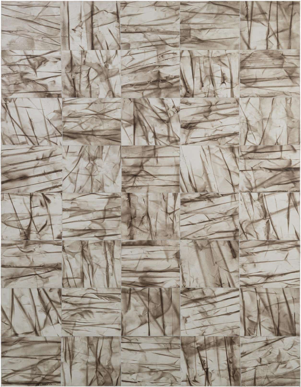 A 5x8 rectangular Cowhide Patchwork rug in shades of gray and silver, featuring a modern, abstract design with varying textures.
