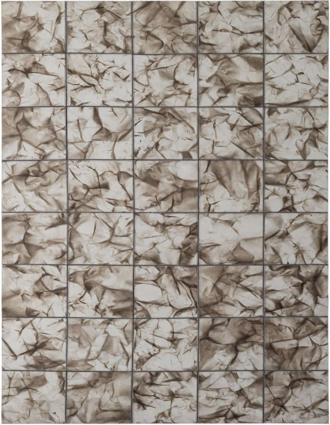 A 5x8 rectangular Cowhide Patchwork rug in shades of gray and silver, featuring a modern, textured design.