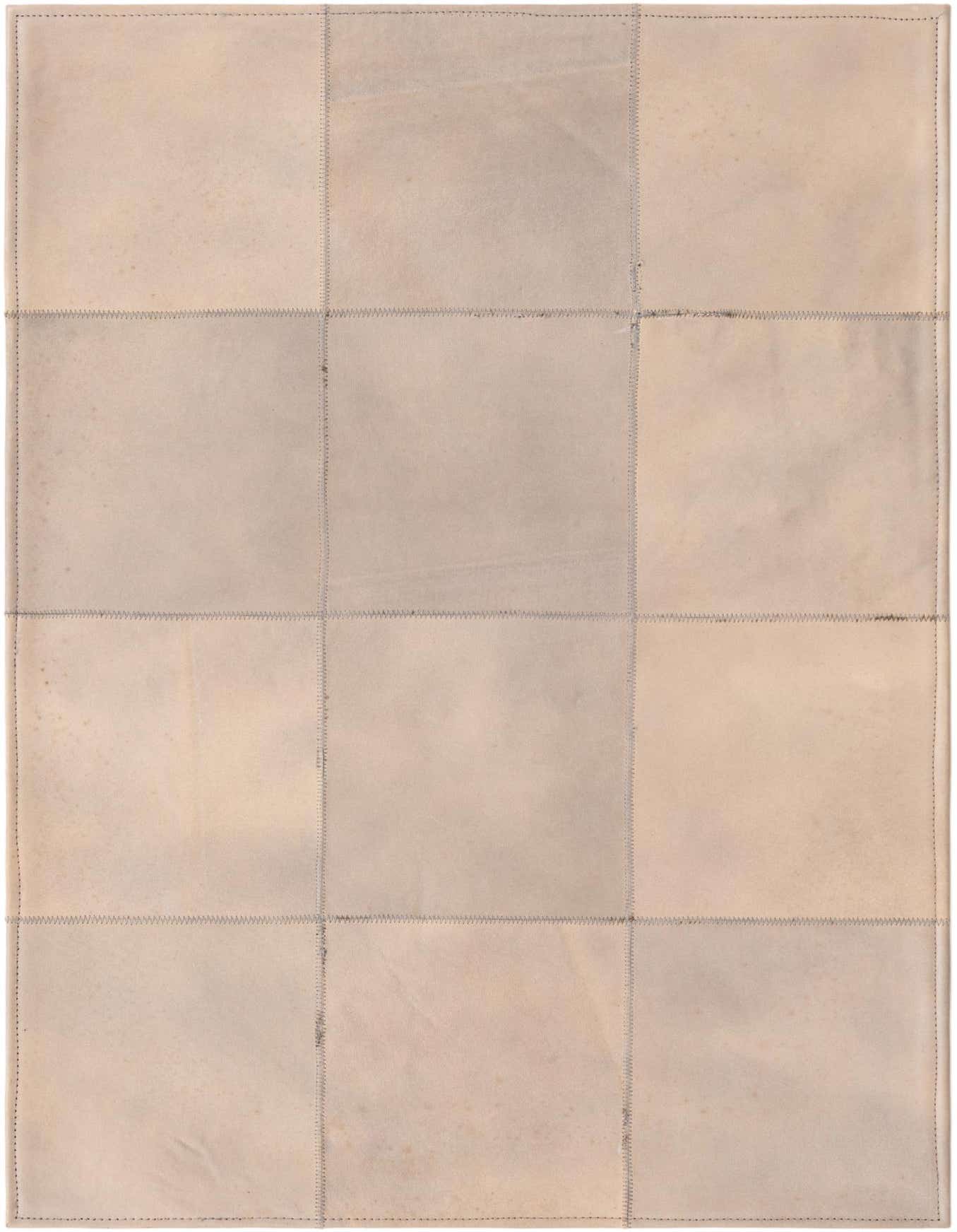 A 2x3 rectangular Rugs.com Cowhide Leather rug in shades of gray, featuring a modern patchwork design with visible stitching.