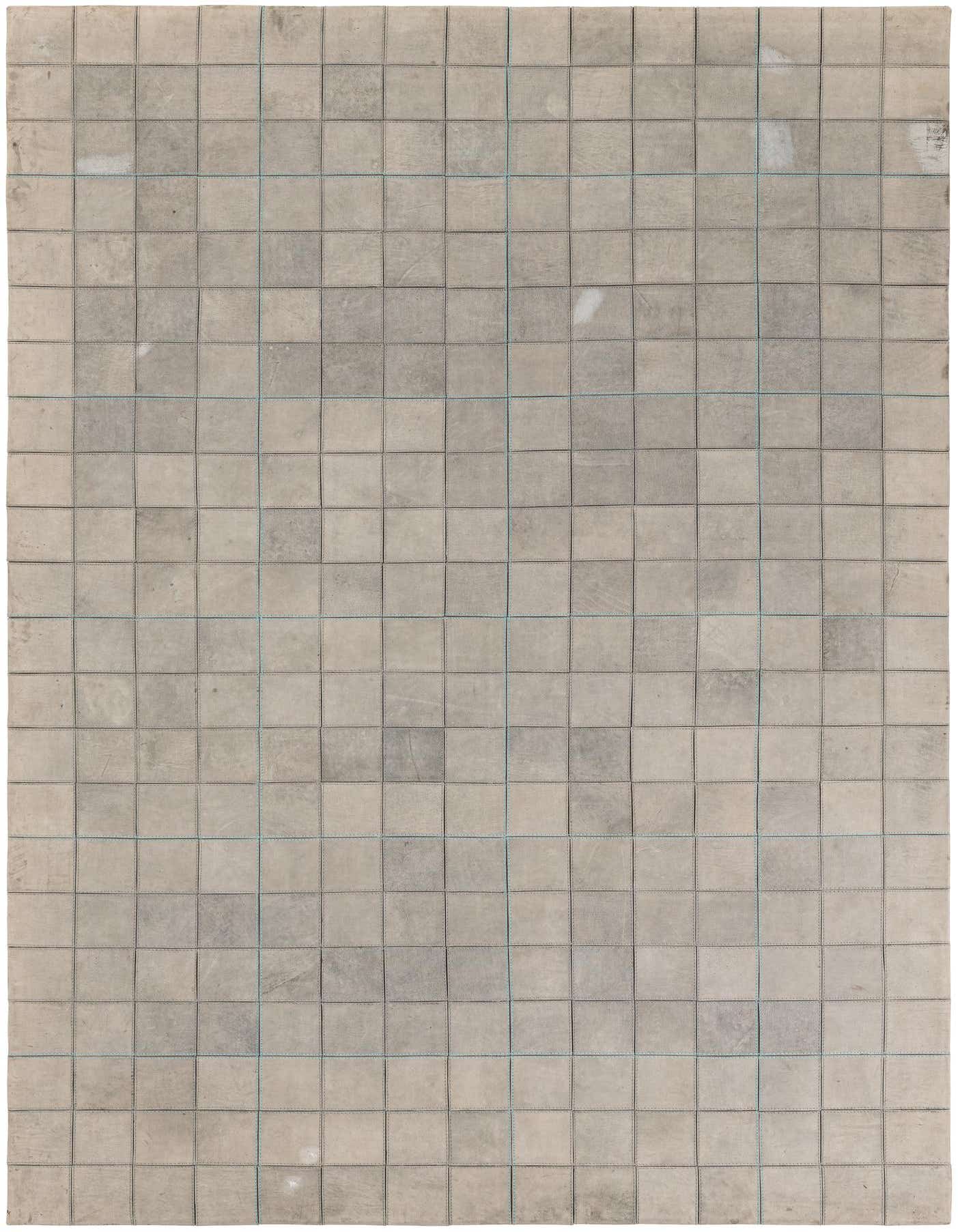A 5x8 rectangular gray cowhide and leather rug featuring a modern grid pattern of stitched square patches.