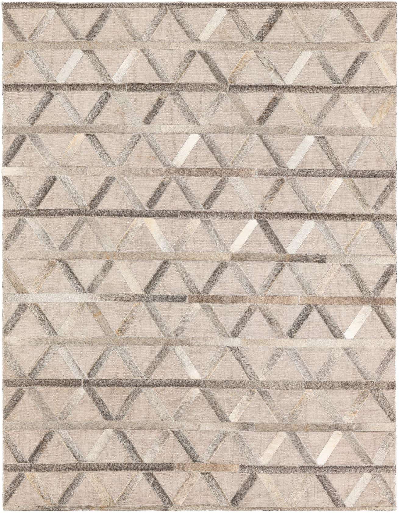 A 4x6 rectangular Cowhide & Leather rug featuring a modern abstract pattern of gray and silver triangles on a light beige background.