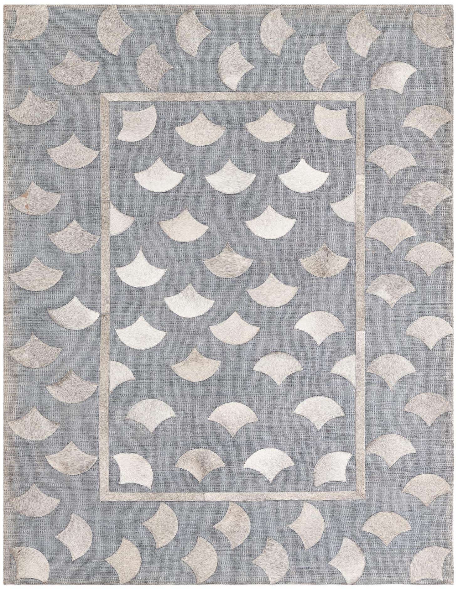 A 4x6 rectangular gray cowhide and leather rug with an abstract fan-shaped pattern and a subtle border.