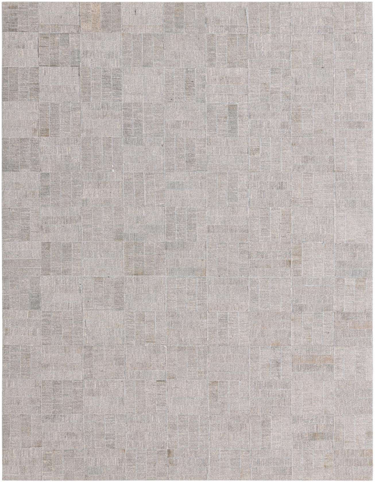 A 4x6 rectangular gray cowhide rug featuring a modern patchwork design, ideal for a living room or office.