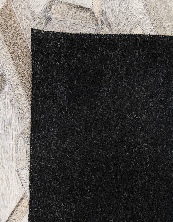 Detail image of  5' 1 x 7' 11 Cowhide Stocks Rug