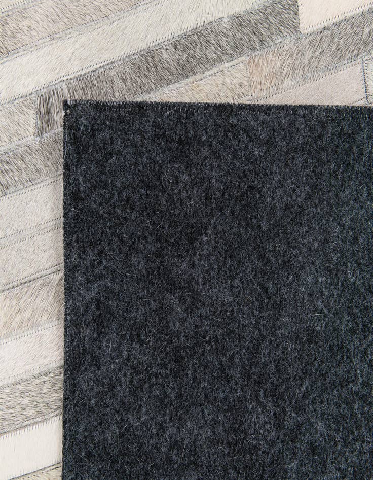 Detail image of  5' 1 x 8' Cowhide Stocks Rug