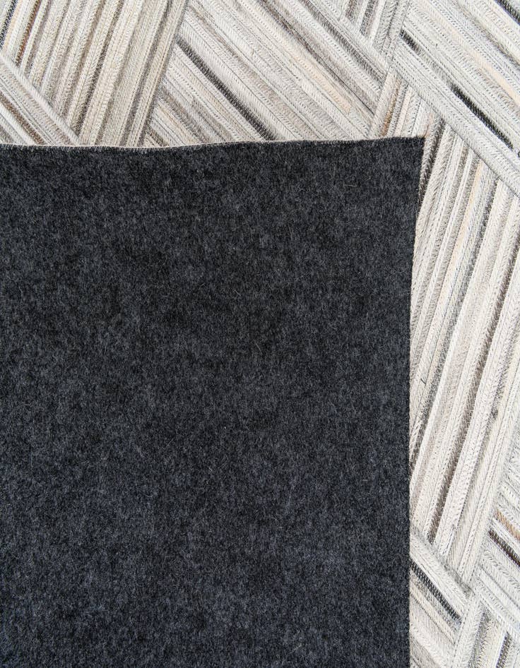 Detail image of  4' 11 x 8' 2 Cowhide Stocks Rug