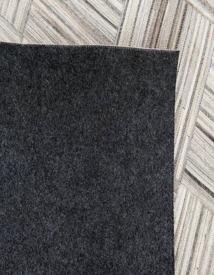 Detail image of  4' 11 x 8' 2 Cowhide Stocks Rug