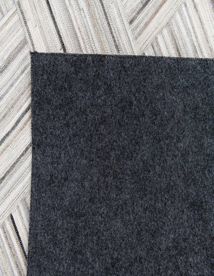 Detail image of  4' 11 x 8' 2 Cowhide Stocks Rug