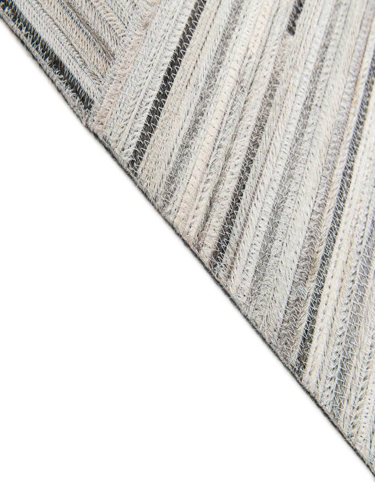 Detail image of  4' 11 x 8' 2 Cowhide Stocks Rug