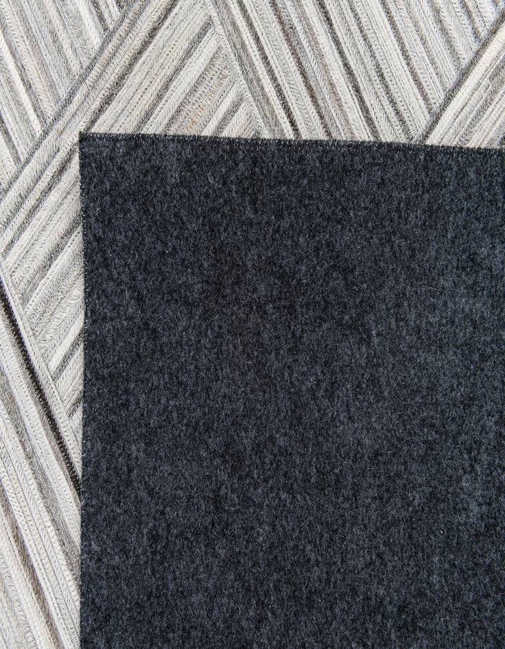 Detail image of  4' 11 x 8' 2 Cowhide Stocks Rug