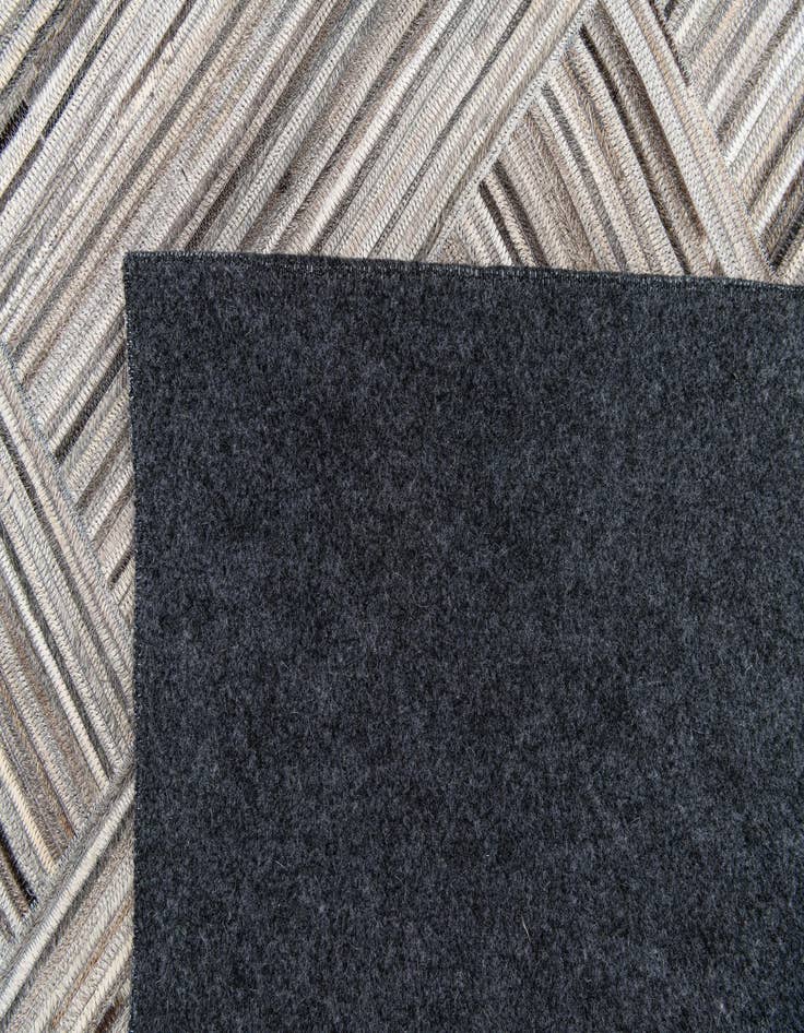 Detail image of  4' 11 x 8' 1 Cowhide Stocks Rug
