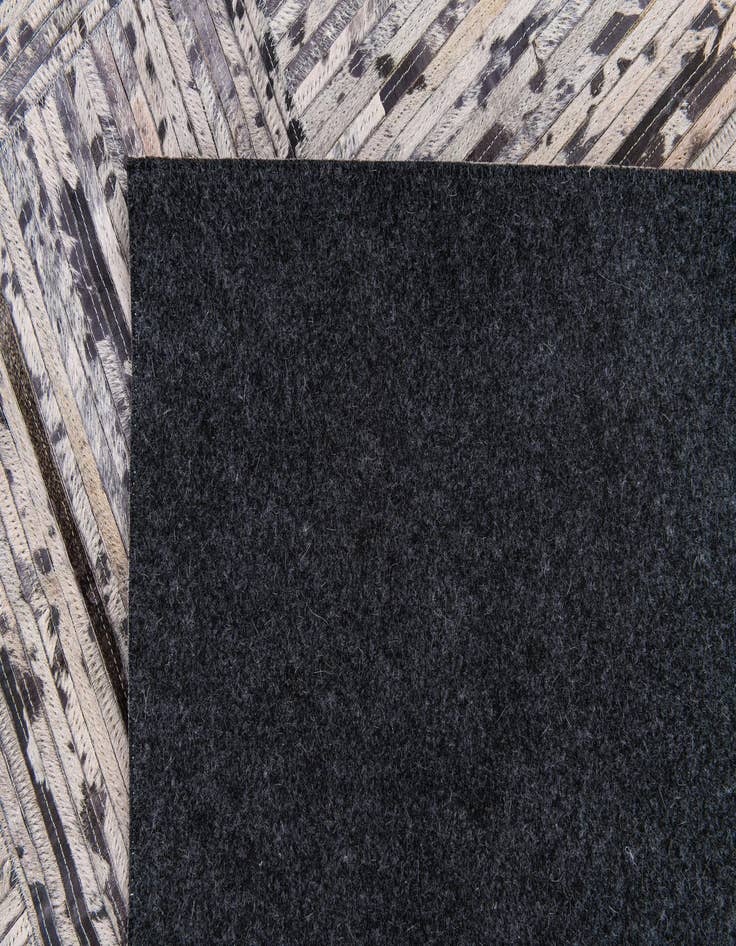 Detail image of  4' 11 x 7' 10 Cowhide Stocks Rug