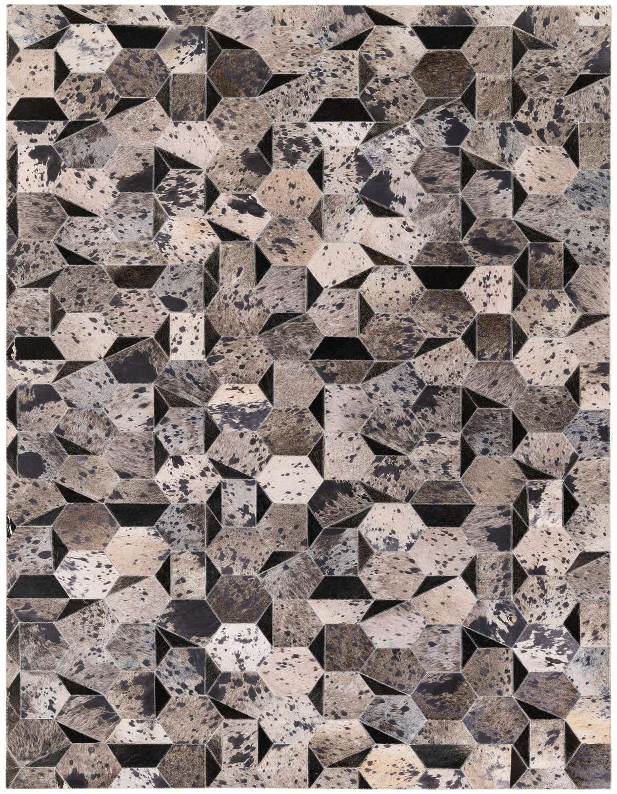 A 5x8 rectangular Cowhide Stocks rug featuring a modern geometric pattern of gray, silver, and black hexagonal patches.
