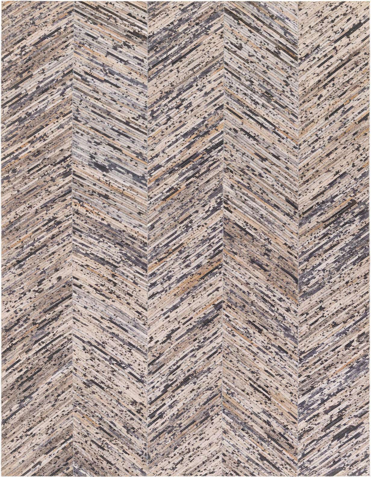 A rectangular 5x8 gray modern cowhide rug with a distressed chevron pattern, suitable for a living room.