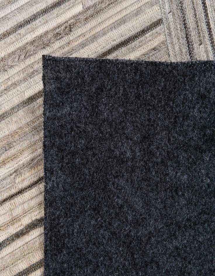 Detail image of  4' 11 x 8' 2 Cowhide Stocks Rug