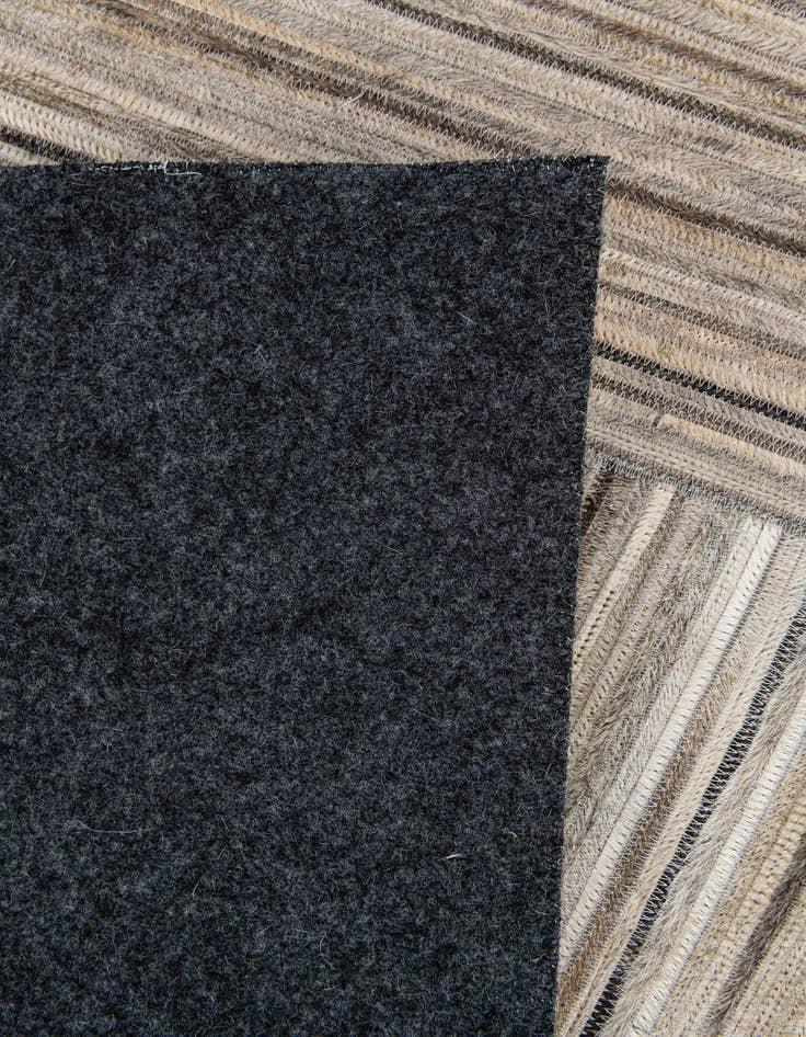 Detail image of  4' 11 x 8' 3 Cowhide Stocks Rug