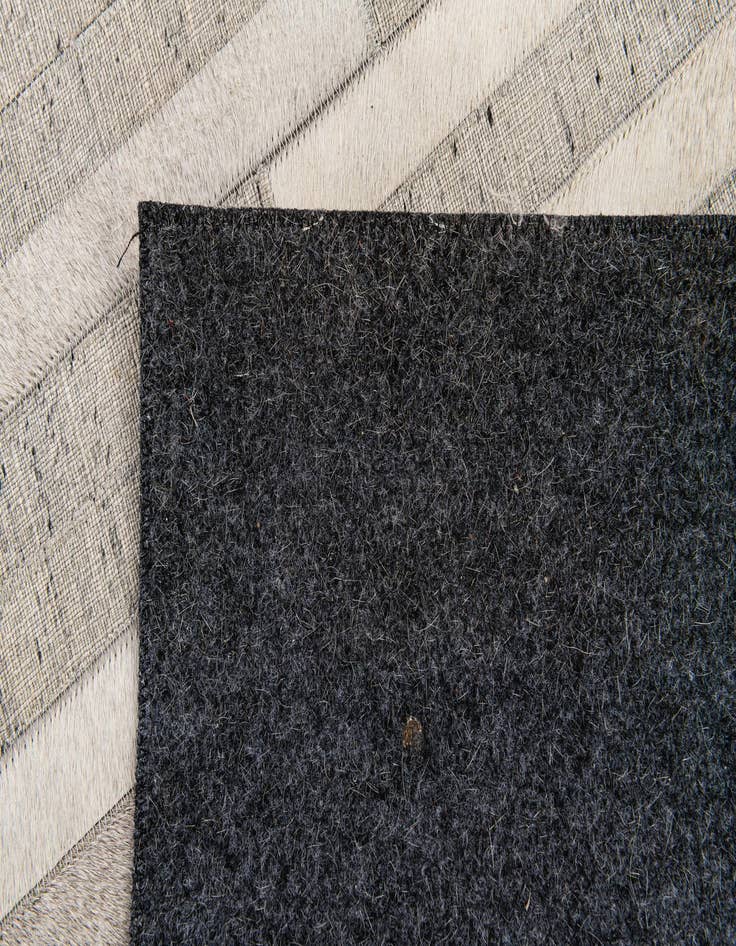 Detail image of  4' 1 x 6' 1 Cowhide Stocks Rug