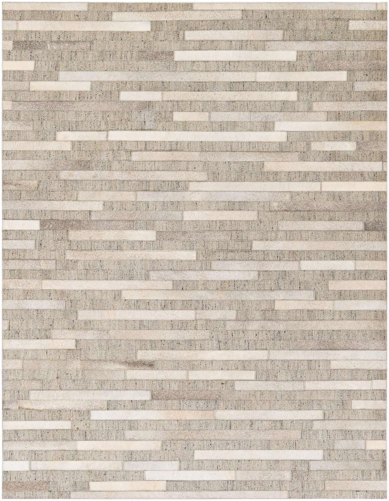 A 4x6 rectangular Cowhide Stocks rug by Rugs.com featuring a modern patchwork of gray and silver cowhide and leather strips.