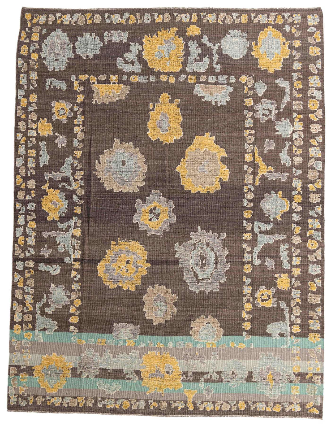 A 10x14 rectangular gray wool rug with a modern abstract pattern of yellow, light blue, and beige floral shapes.