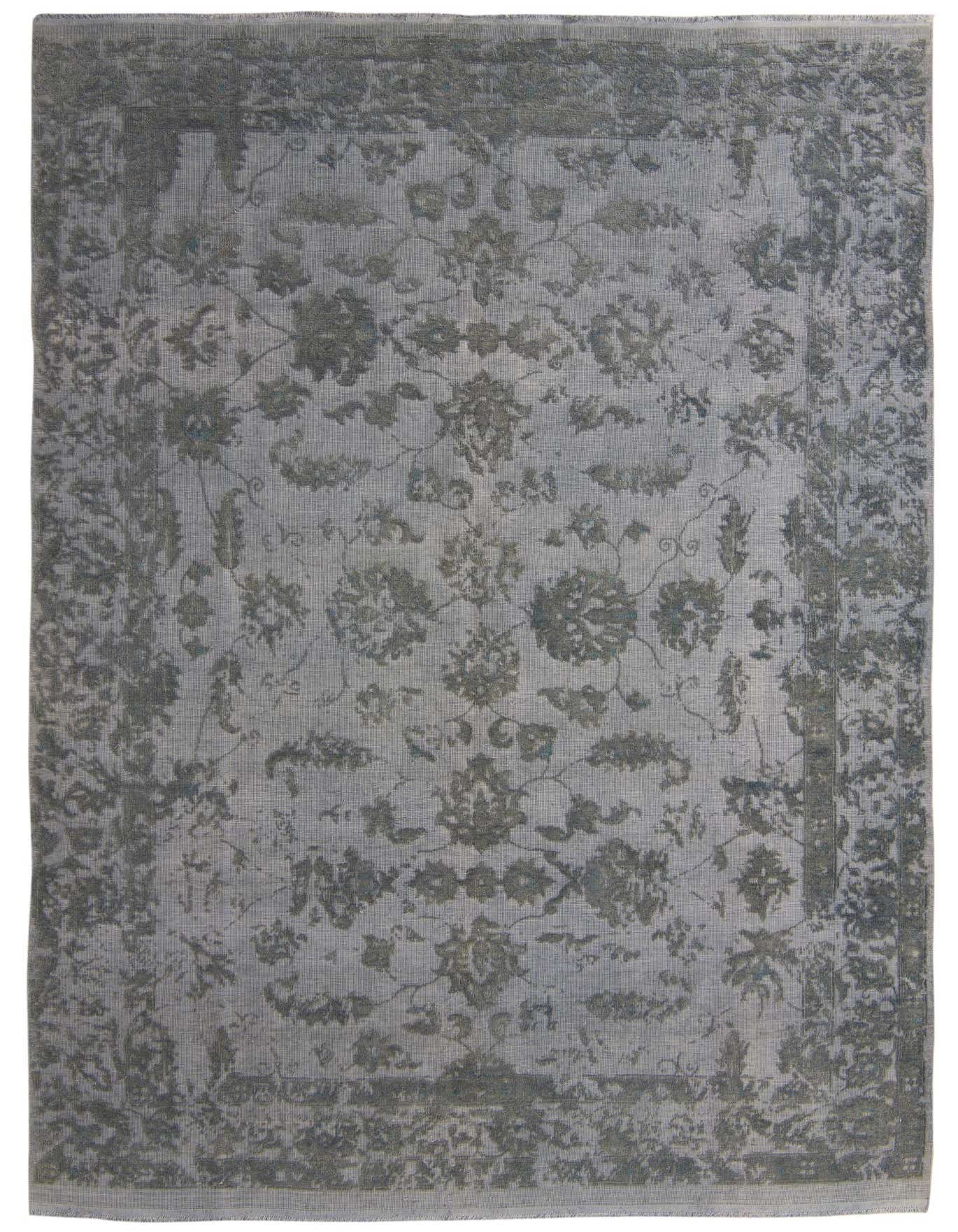 An 8x11 rectangular Darya rug in shades of gray and silver, featuring a distressed modern oriental floral pattern.