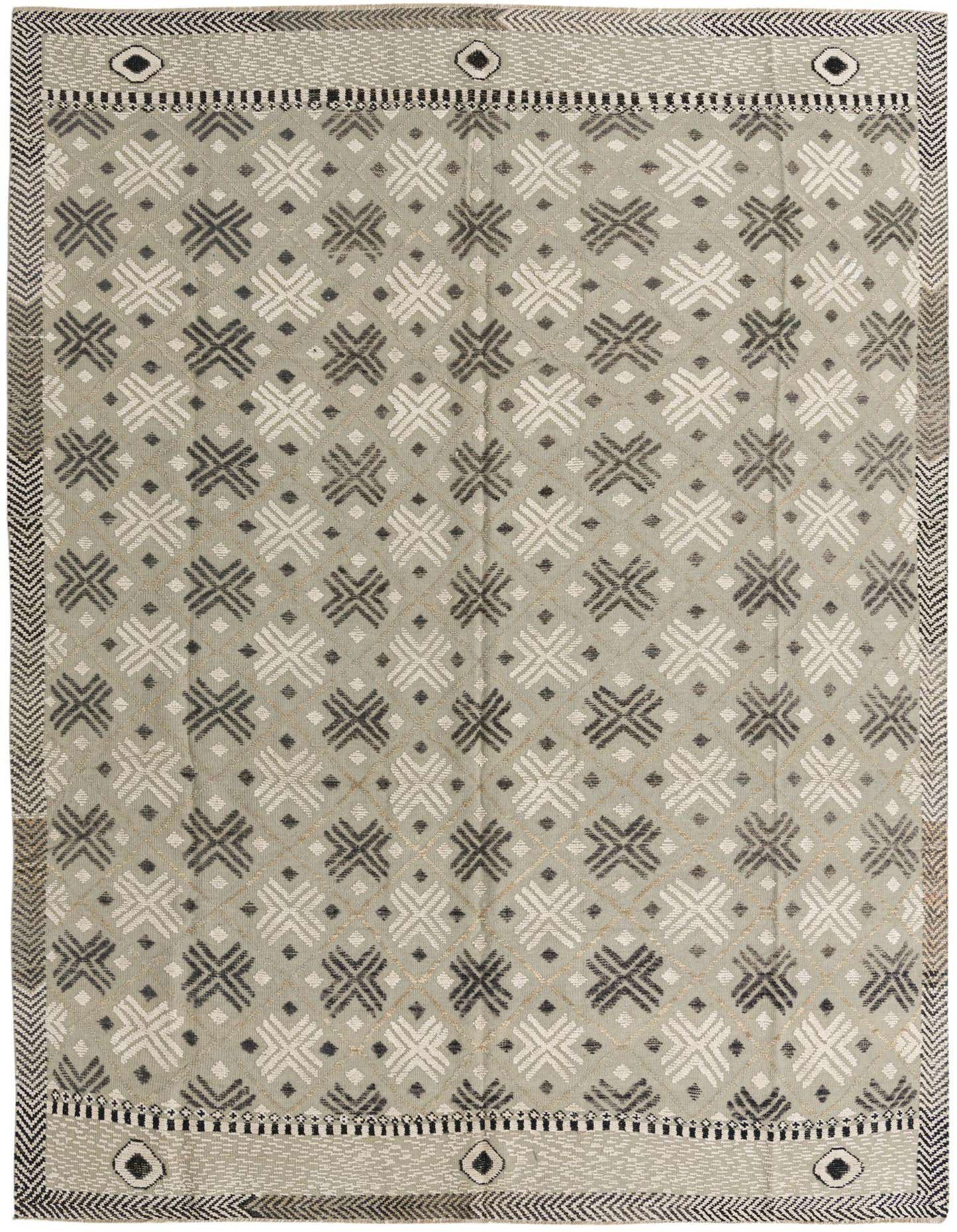 A rectangular 9x12 gray wool area rug featuring a modern abstract pattern of interlocking X shapes and small diamonds in varying shades of gray, silver, and white, with a decorative border.