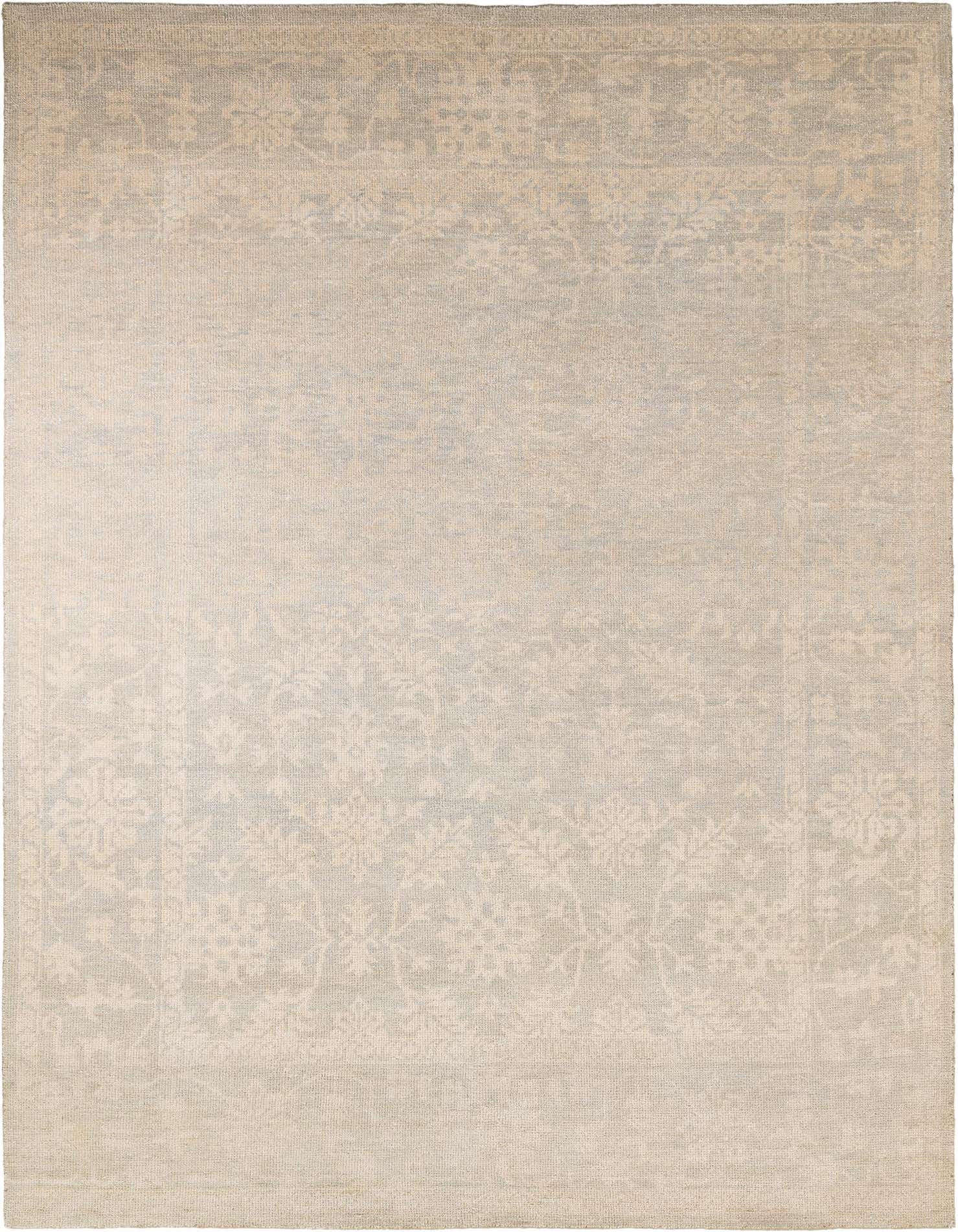 A 9x12 rectangular gray wool rug with a subtle traditional floral pattern and a high pile.
