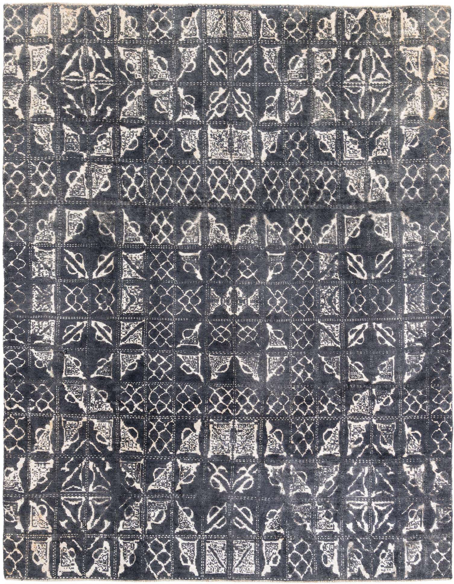 A 9x12 rectangular gray modern area rug with a high pile, featuring an abstract geometric pattern in lighter gray tones.